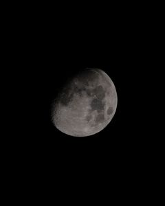 A crisp capture of the moon showcasing its detailed craters against a dark sky.